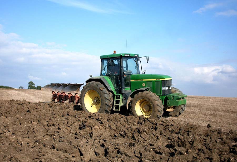 Tractor with plough